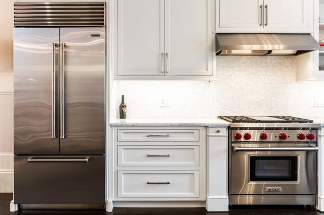 a kitchen with appliances and cabinets
