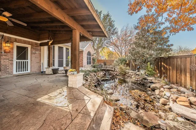 a view of a porch with wooden stairs and bench