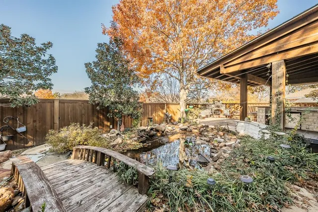 a view of a backyard with sitting area
