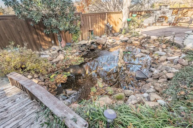 a view of a backyard of the house