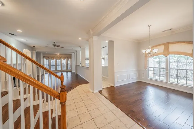 a view of an entryway with wooden floor