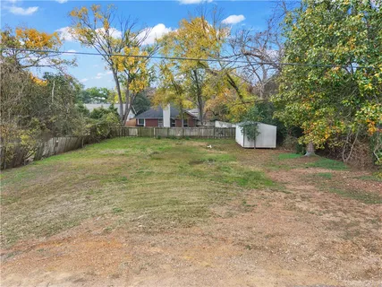 a view of a field with trees
