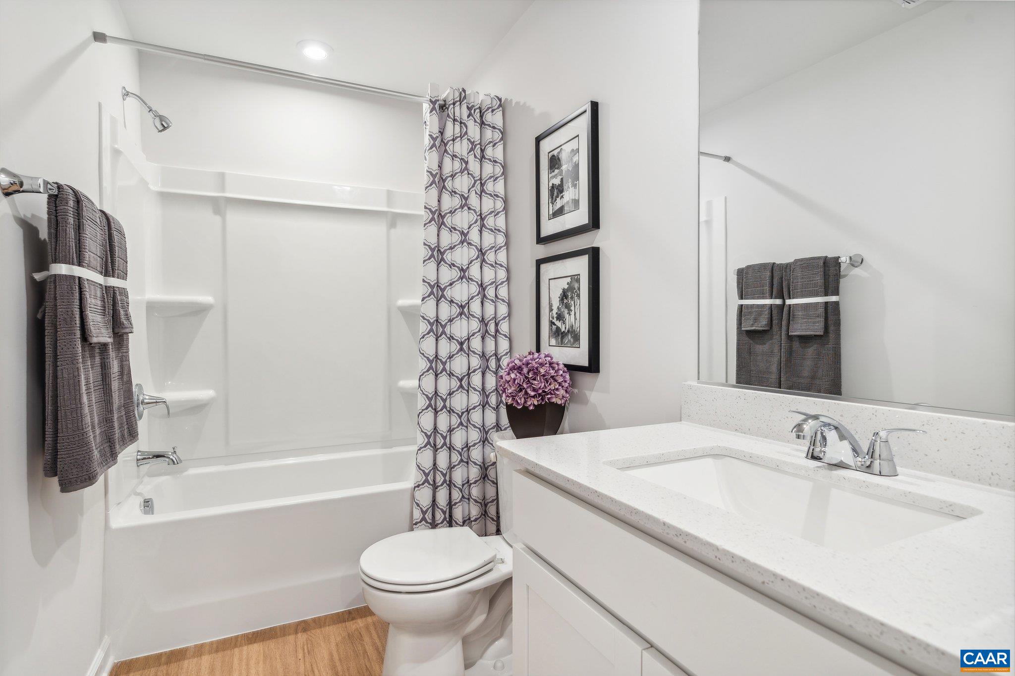 247 Trailfork Road Barboursville, VA 22923 - Photo 11 of 40 a bathroom with a granite countertop sink toilet and shower
