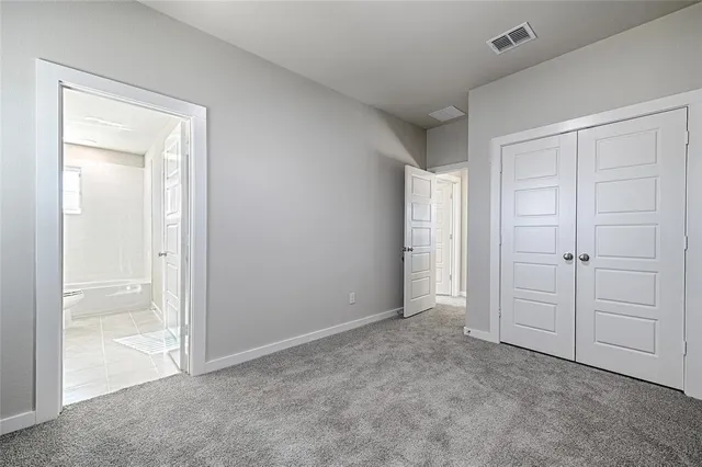 a kitchen with granite countertop white cabinets stainless steel appliances and sink