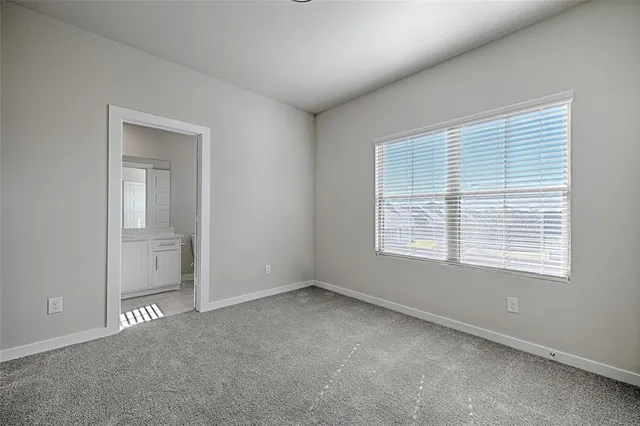 a bathroom with a shower and a glass door