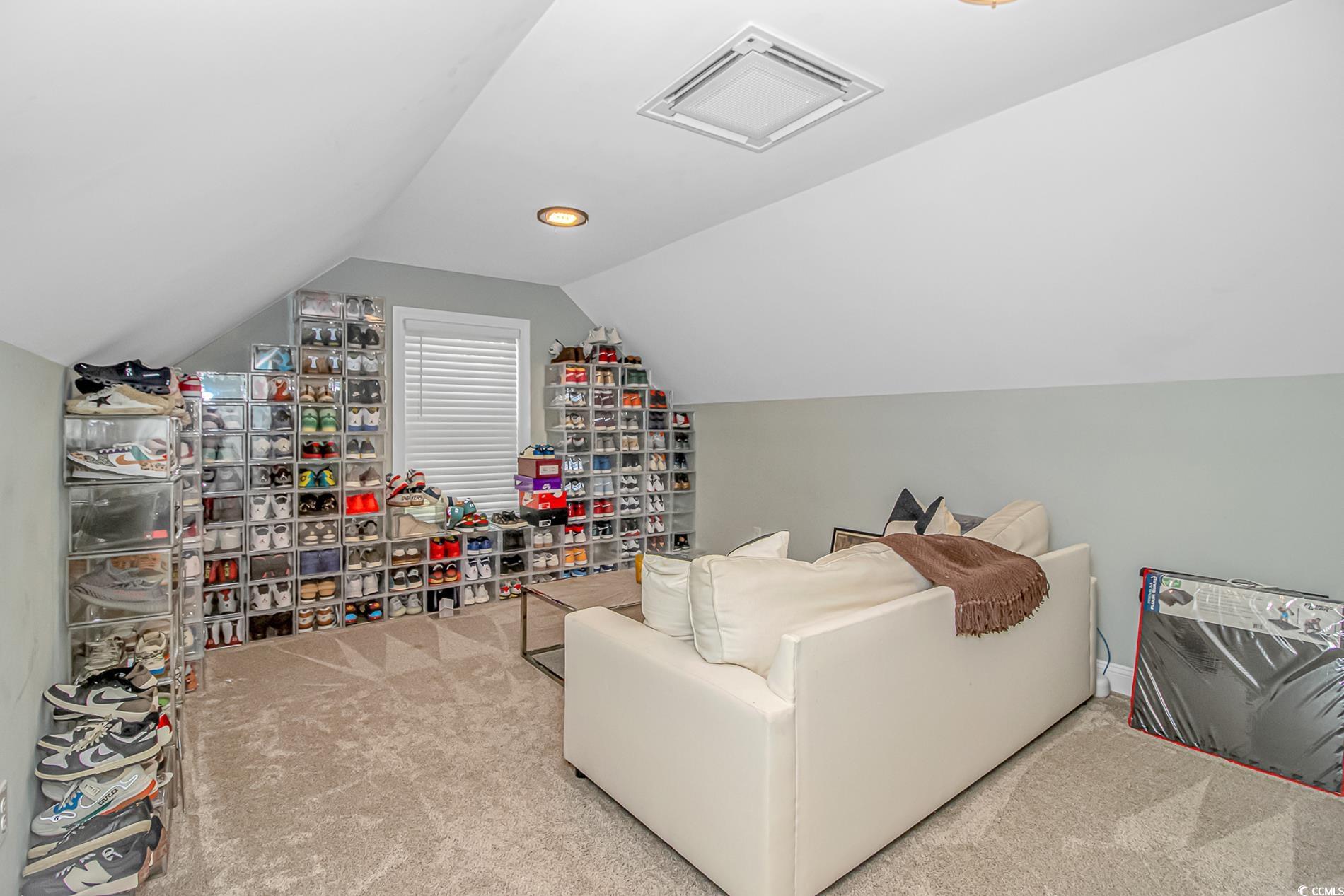 4383 River Road Little River, SC 29566 - Photo 22 of 40 Living area featuring carpet and lofted ceiling