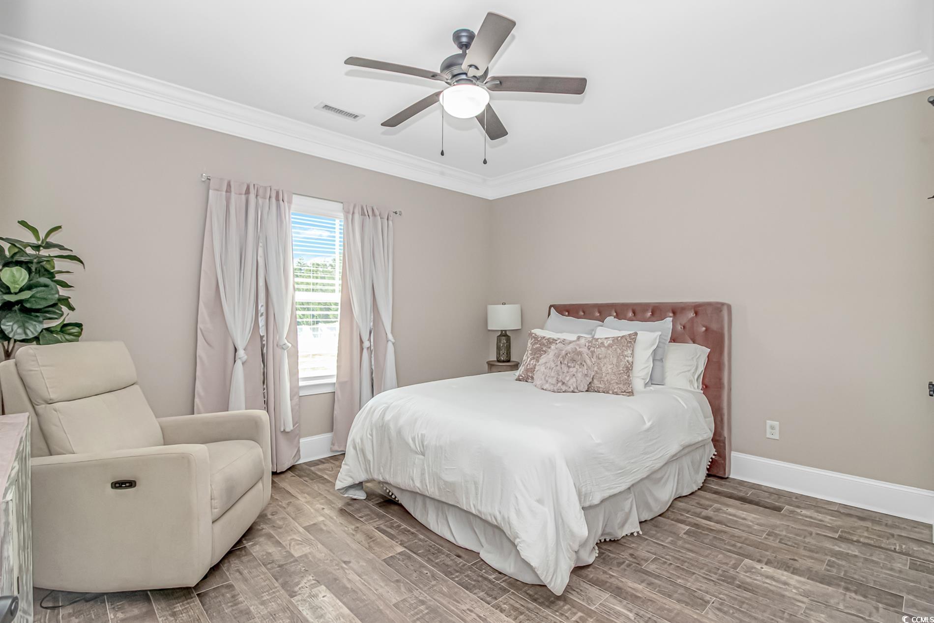 4383 River Road Little River, SC 29566 - Photo 26 of 40 Bedroom with ornamental molding, wood finished floors, and ceiling fan