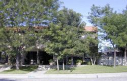 a view of a building with trees