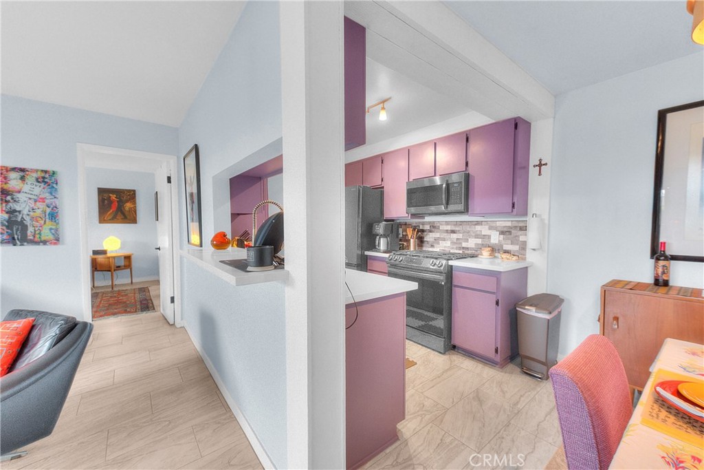 6351 Riverside Drive, Unit 69 Chino, CA 91710 - Photo 7 of 21 a view of kitchen with stainless steel appliances kitchen island granite countertop lots of counter top space