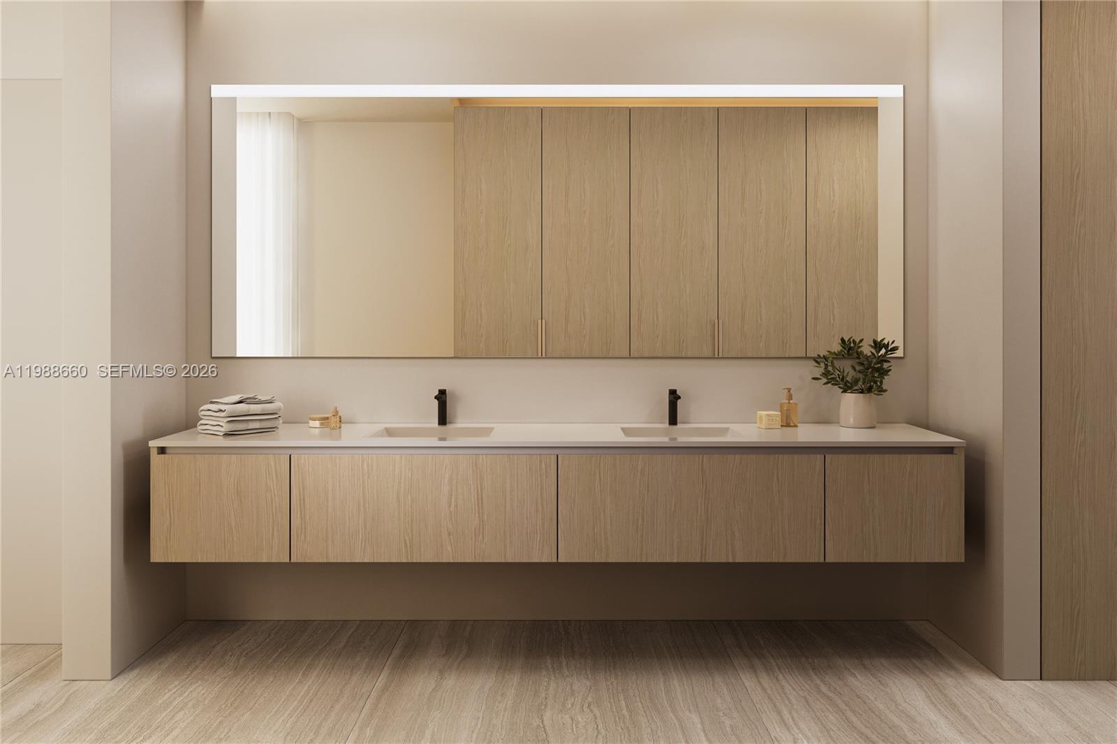 829 4th Street, Unit 2 Miami Beach, FL 33139 - Photo 26 of 27 a bathroom with a sink and mirror
