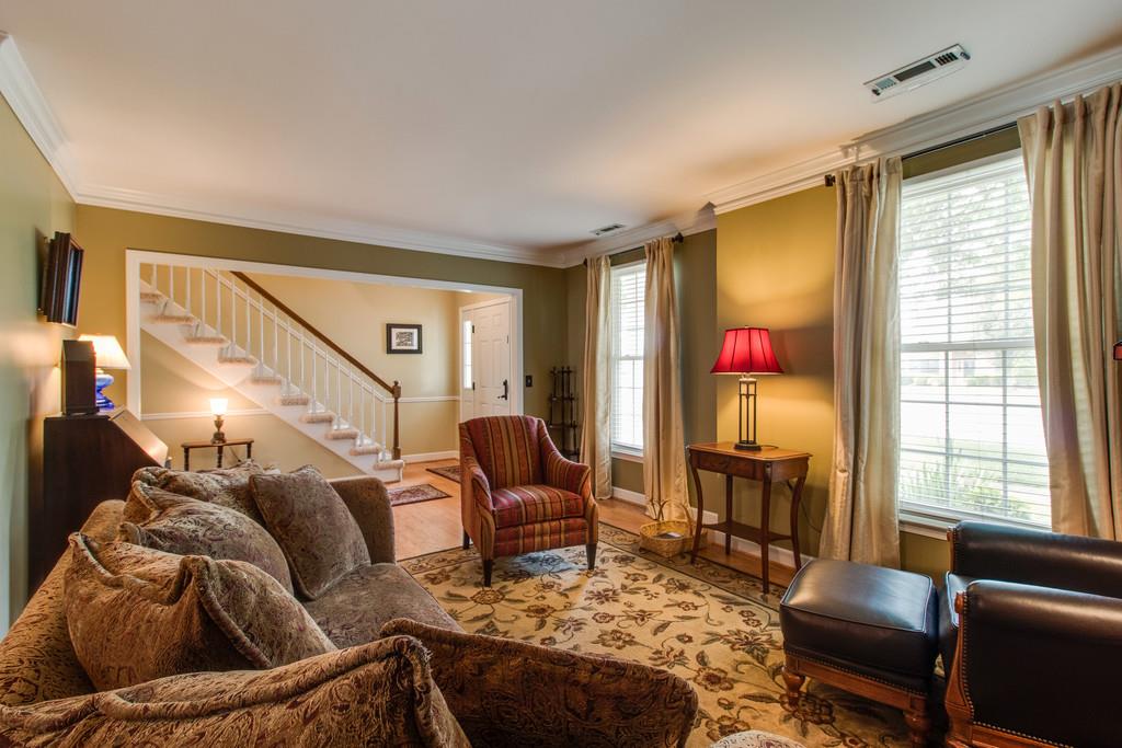 8953 Sawyer Brown Road Nashville, TN 37221 - Photo 3 of 30 a living room with furniture and a flat screen tv