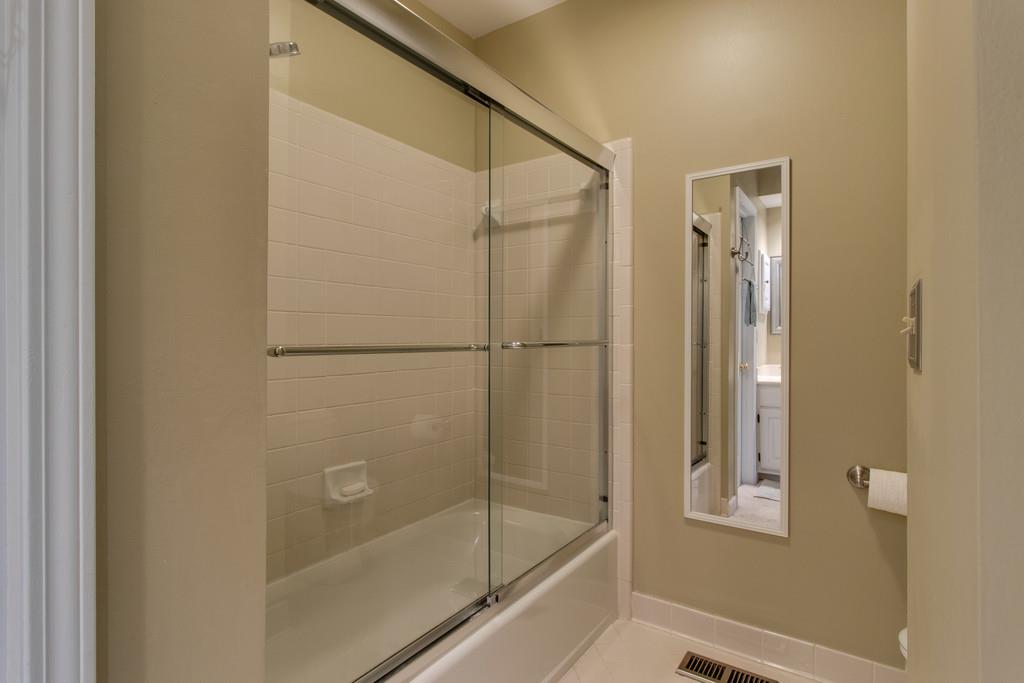 8953 Sawyer Brown Road Nashville, TN 37221 - Photo 22 of 30 a bathroom with a glass shower door