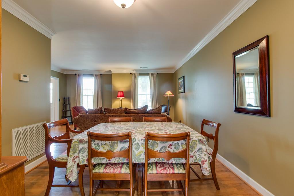 8953 Sawyer Brown Road Nashville, TN 37221 - Photo 8 of 30 a view of a dining room with furniture and wooden floor