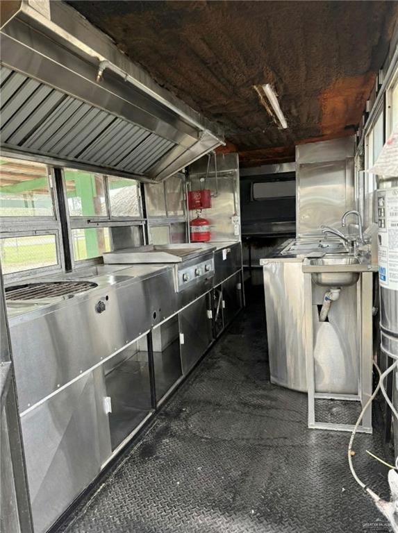 9600 Val Verde Road Donna, TX 78537 - Photo 6 of 6 a kitchen with stainless steel appliances granite countertop a sink a stove and a refrigerator