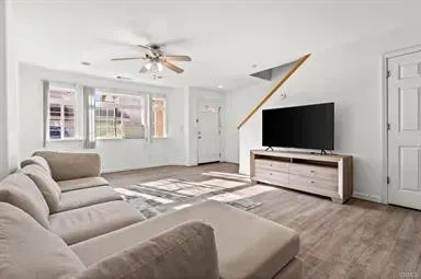 a bedroom with furniture and a flat screen tv