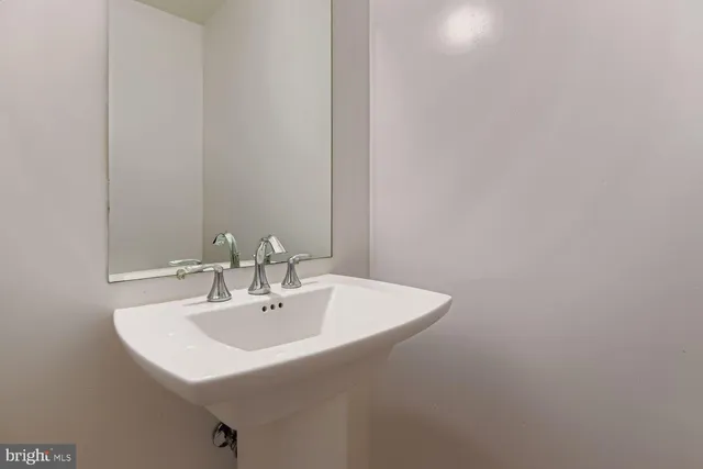 a white sink sitting next to a white sink