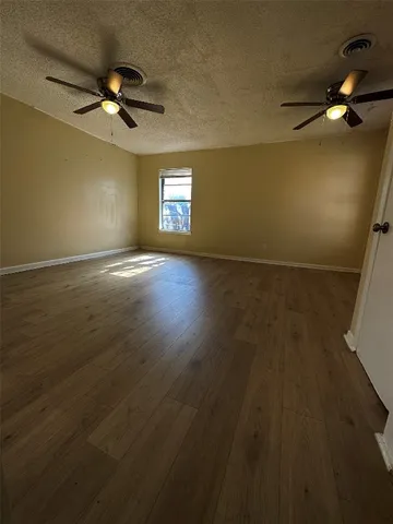 a bathroom with a double vanity sink a mirror and a bathtub