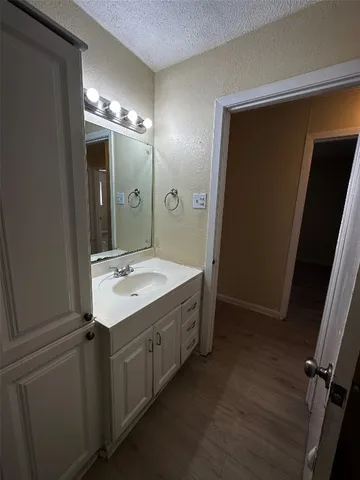 a bathroom with a double vanity sink and mirror