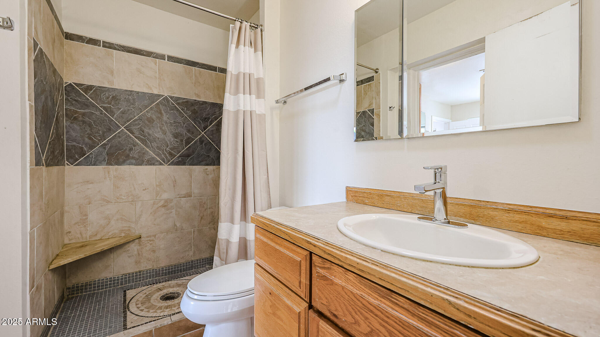 11851 North Thunderbird Road Sun City, AZ 85351 - Photo 29 of 46 a bathroom with a sink and a mirror