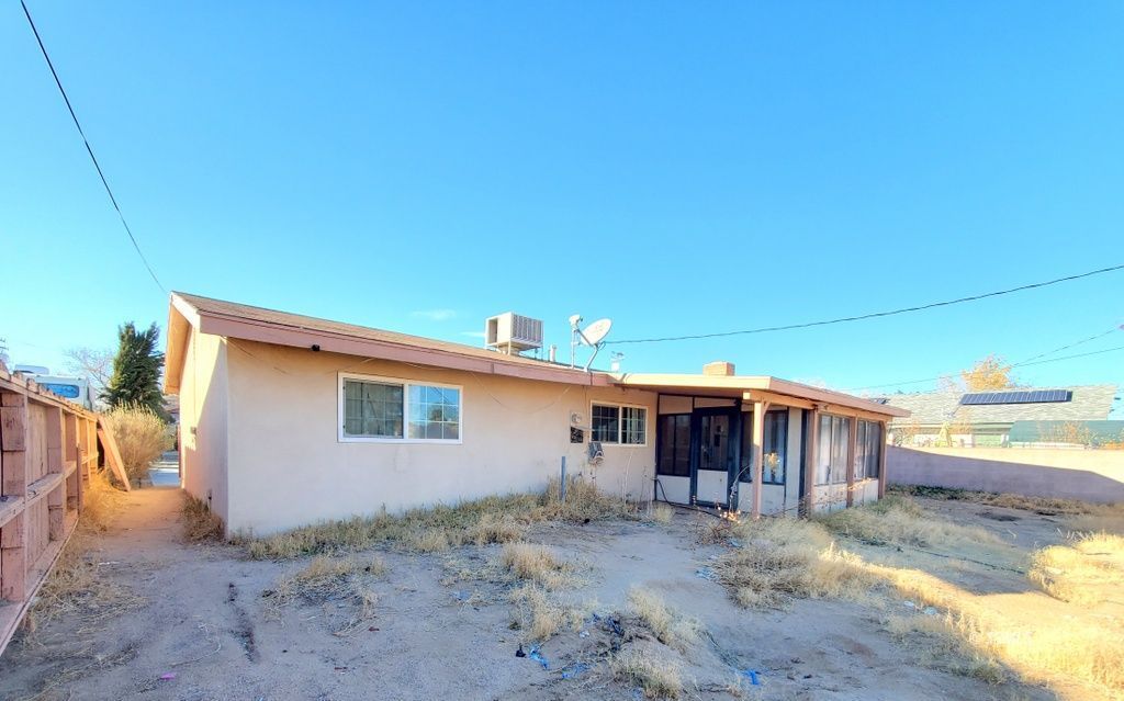 404 Lenore Street Ridgecrest, CA 93555 - Photo 22 of 30 a view of a house with backyard
