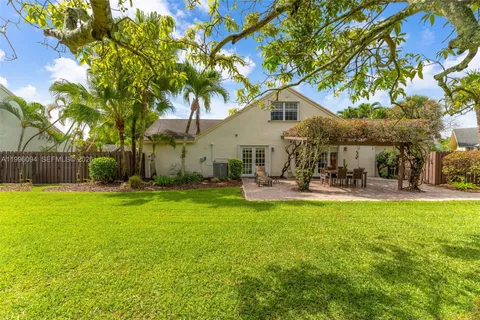a view of a house with backyard and a slide