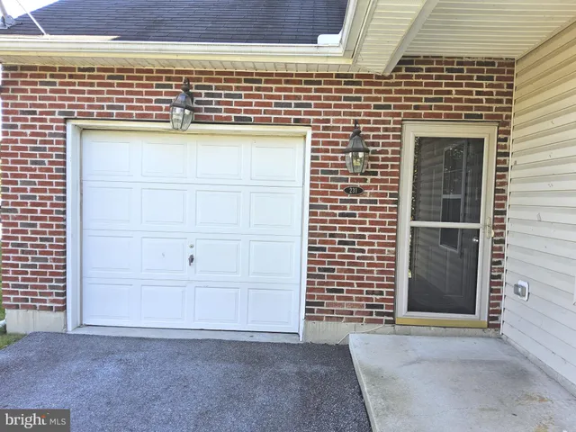 a view of a kitchen with a sink and a fireplace