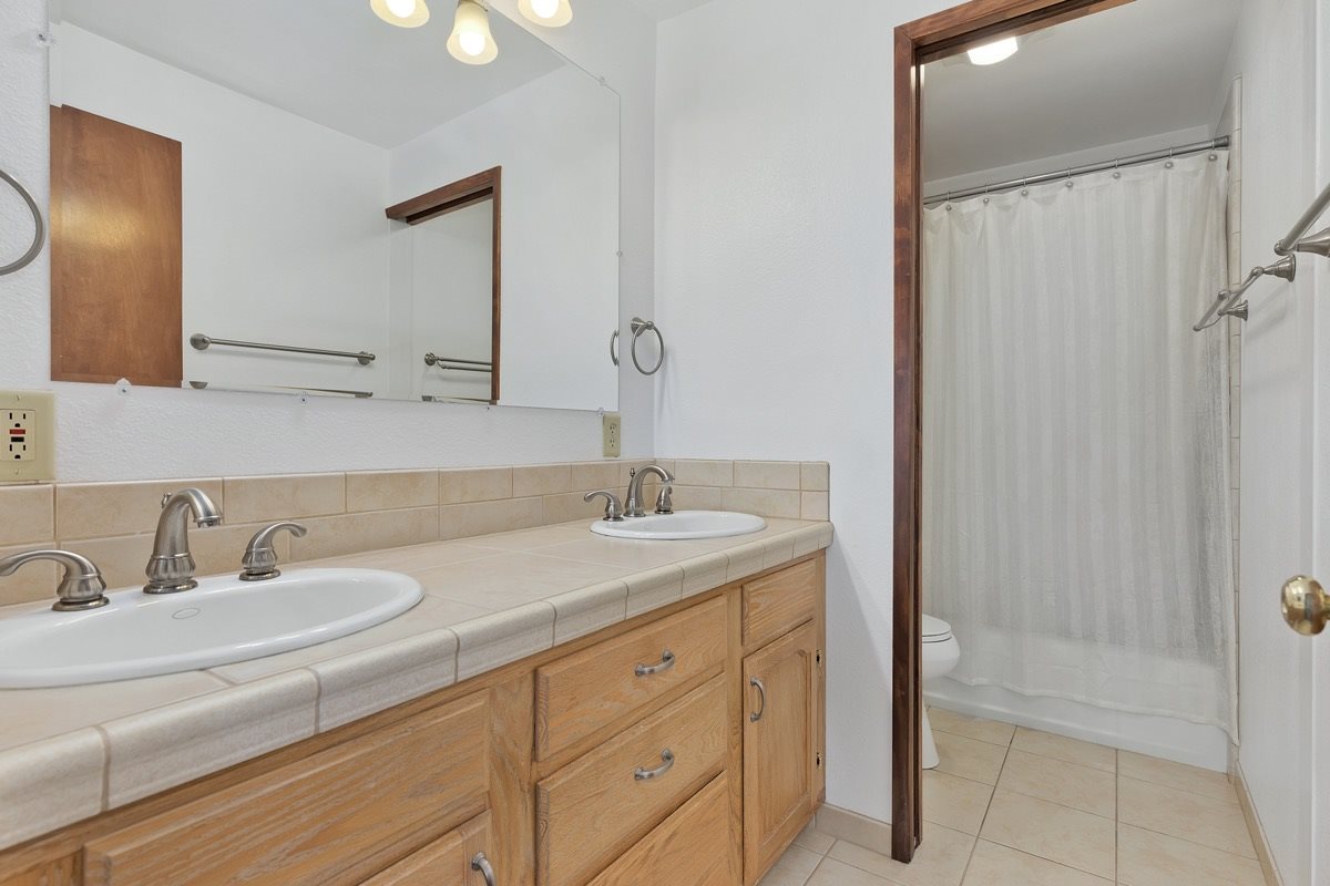 250 Davison Road Mammoth Lakes, CA 93546 - Photo 12 of 30 a bathroom with a sink and a mirror