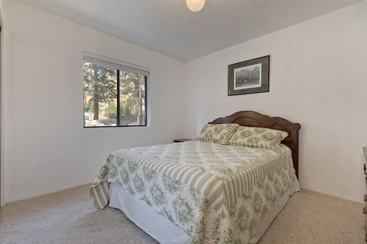 250 Davison Road Mammoth Lakes, CA 93546 - Photo 16 of 30 a bedroom with a bed and painting on the wall
