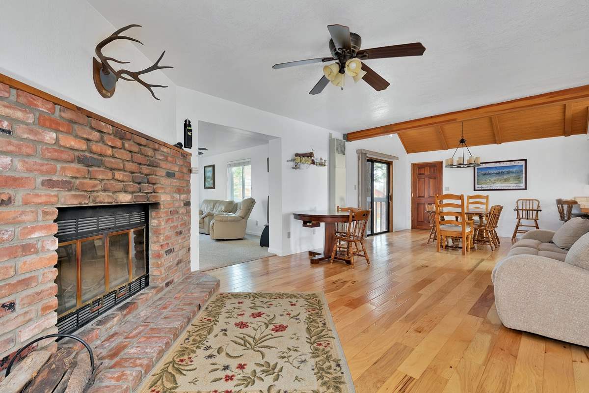 250 Davison Road Mammoth Lakes, CA 93546 - Photo 3 of 30 a living room with furniture and a fireplace