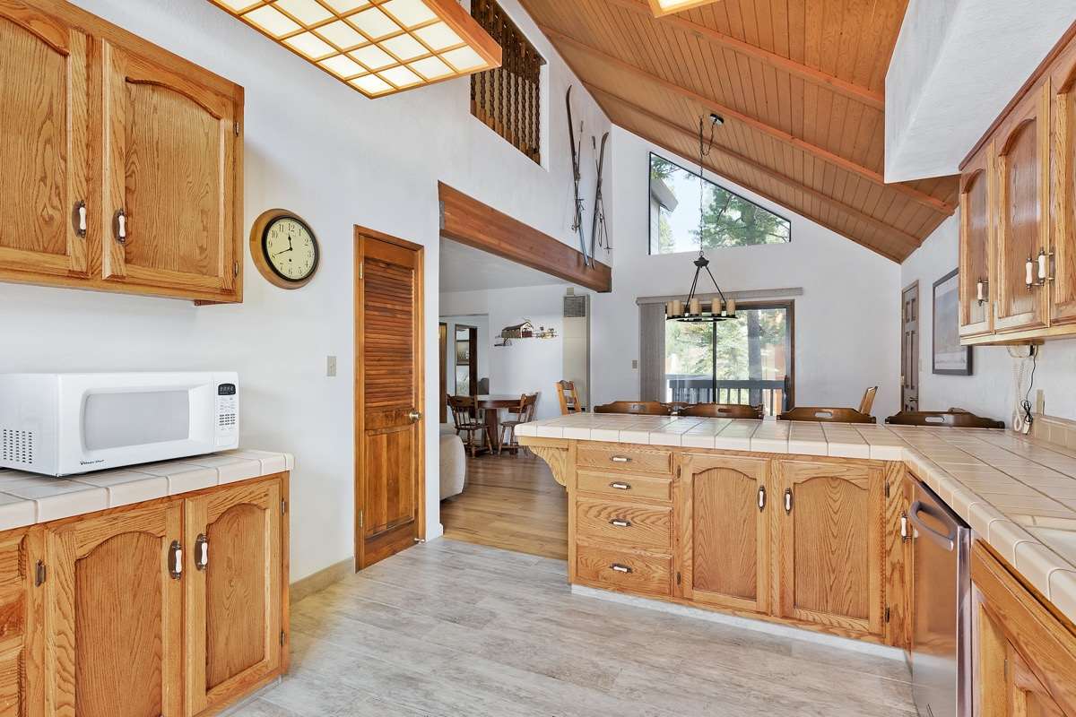 250 Davison Road Mammoth Lakes, CA 93546 - Photo 9 of 30 a open kitchen with stainless steel appliances granite countertop a sink and a cabinets
