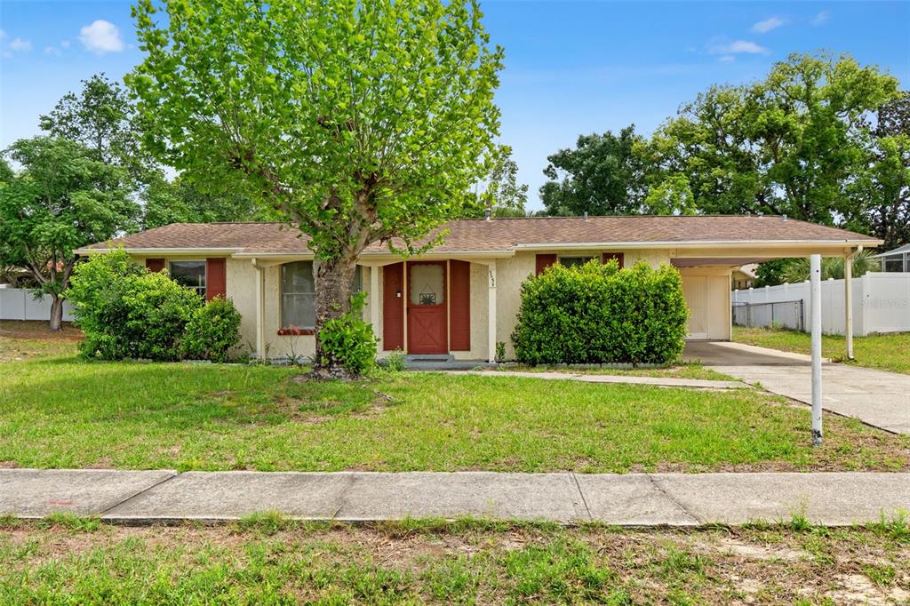 9658 Bayside Court Spring Hill, FL 34608 - Photo 1 of 34 a front view of a house with a yard