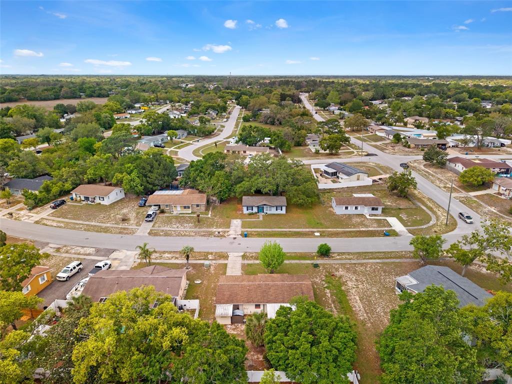 9658 Bayside Court Spring Hill, FL 34608 - Photo 11 of 34 an aerial view of residential houses with outdoor space