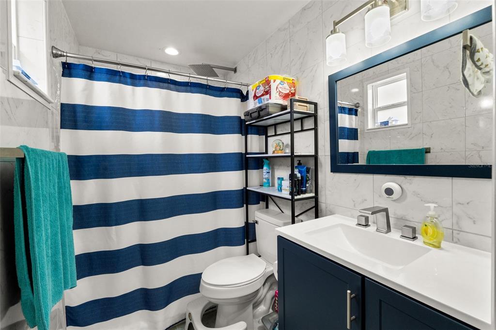 9658 Bayside Court Spring Hill, FL 34608 - Photo 26 of 34 a bathroom with a sink and a mirror