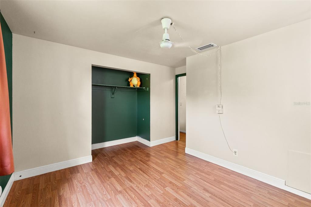 9658 Bayside Court Spring Hill, FL 34608 - Photo 30 of 34 a view of an empty room with wooden floor