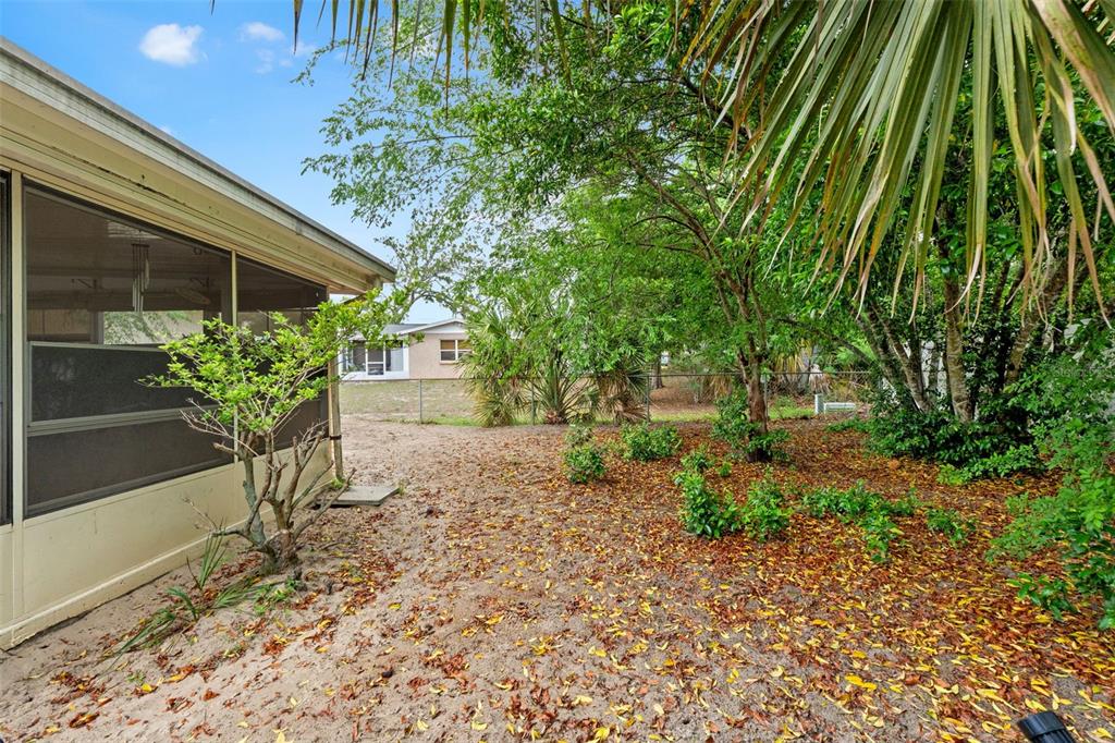 9658 Bayside Court Spring Hill, FL 34608 - Photo 9 of 34 a front view of a house with a yard