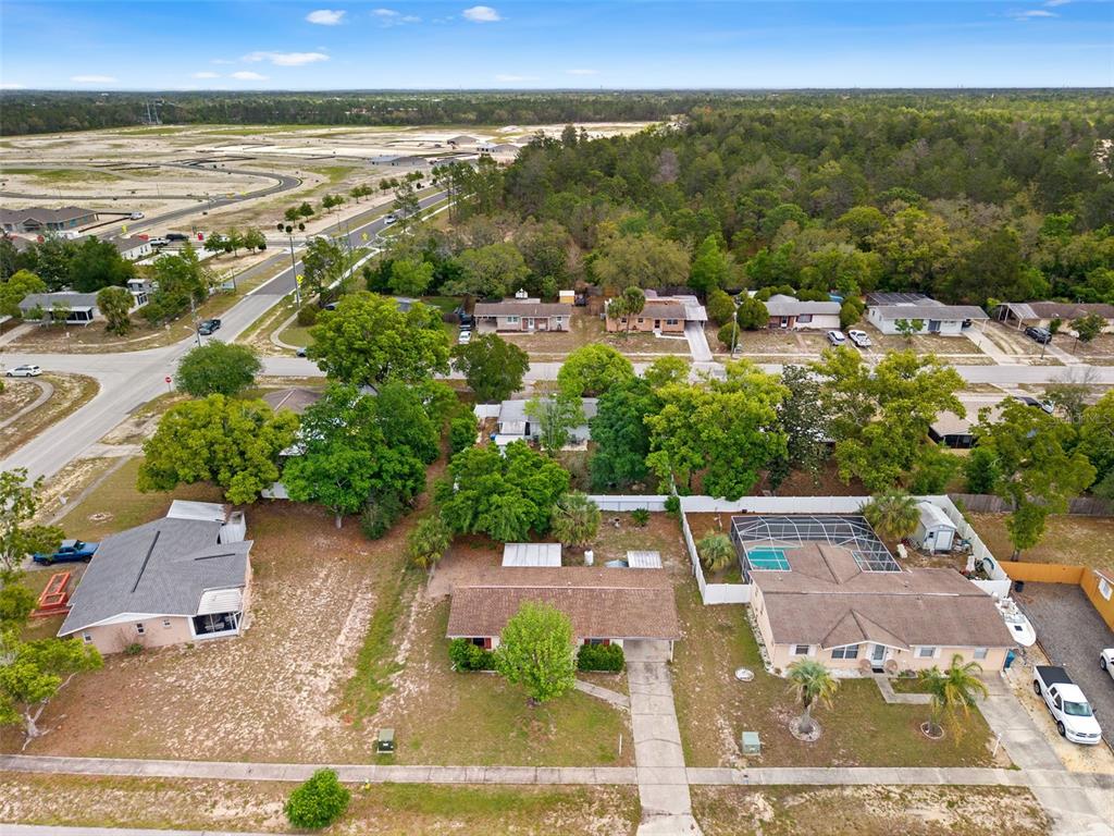 9658 Bayside Court Spring Hill, FL 34608 - Photo 10 of 34 an aerial view of residential houses with outdoor space