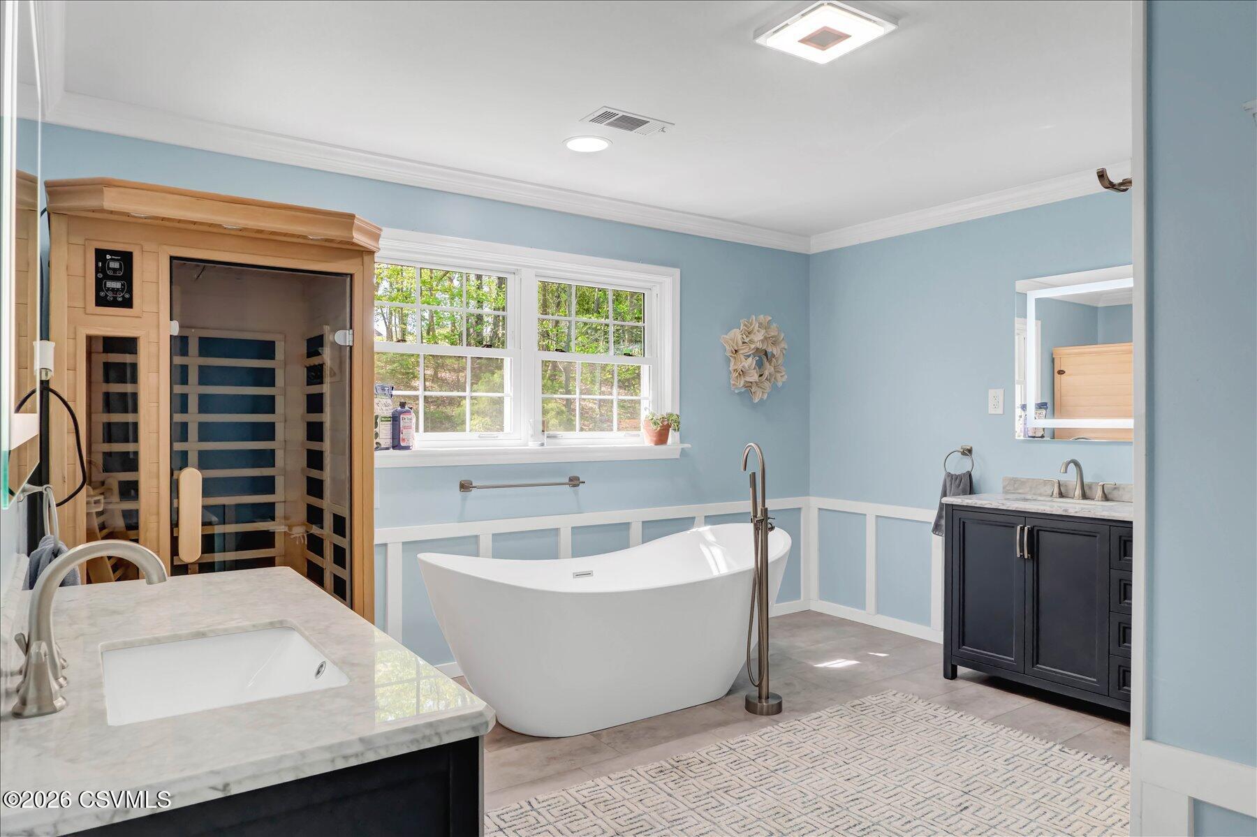 65 Crestview Drive Winfield, PA 17889 - Photo 27 of 70 a white bath tub sitting in a bathroom next to a window