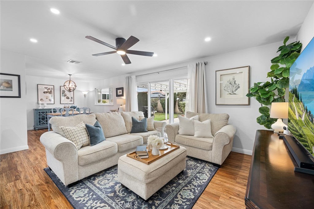 5472 Marion Avenue Cypress, CA 90630 - Photo 1 of 36 a living room with furniture ceiling fan and a rug
