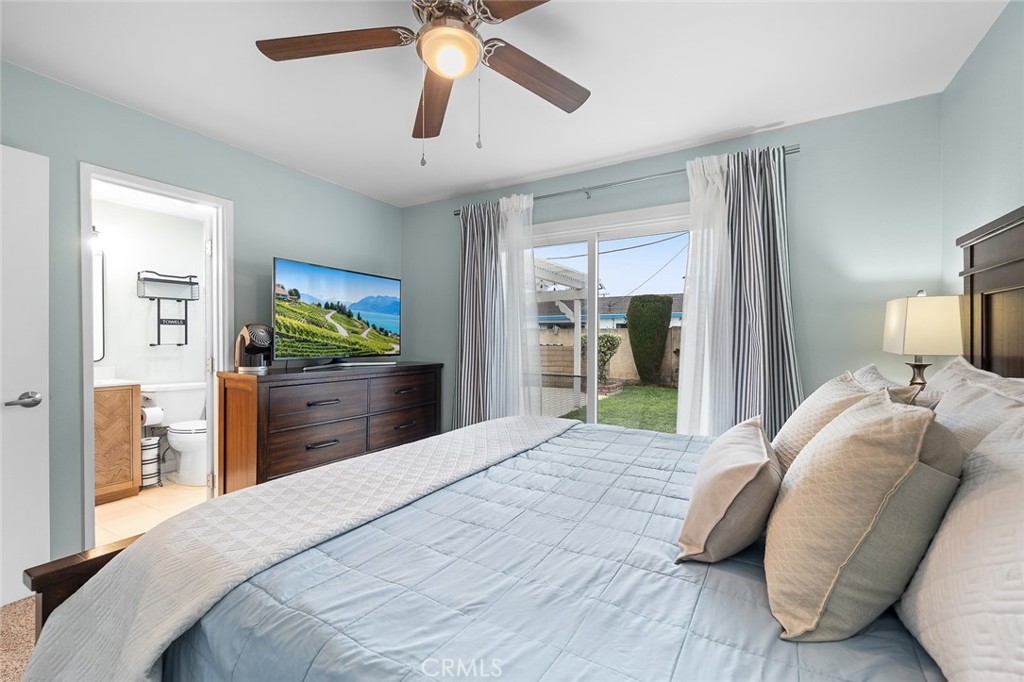 5472 Marion Avenue Cypress, CA 90630 - Photo 20 of 36 a bedroom with a bed and a flat screen tv