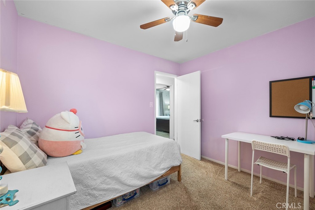 5472 Marion Avenue Cypress, CA 90630 - Photo 22 of 36 a bedroom with a bed and a flat screen tv