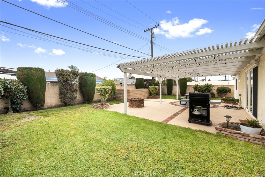 5472 Marion Avenue Cypress, CA 90630 - Photo 30 of 36 a view of a patio with a table and chairs