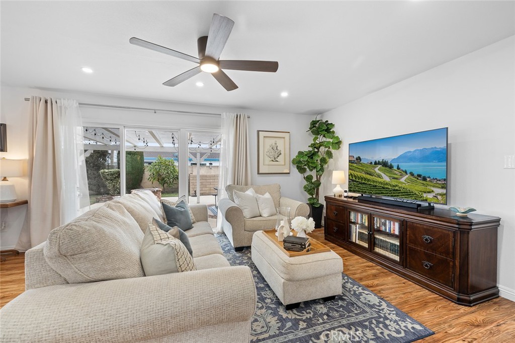 5472 Marion Avenue Cypress, CA 90630 - Photo 3 of 36 a living room with furniture and a flat screen tv