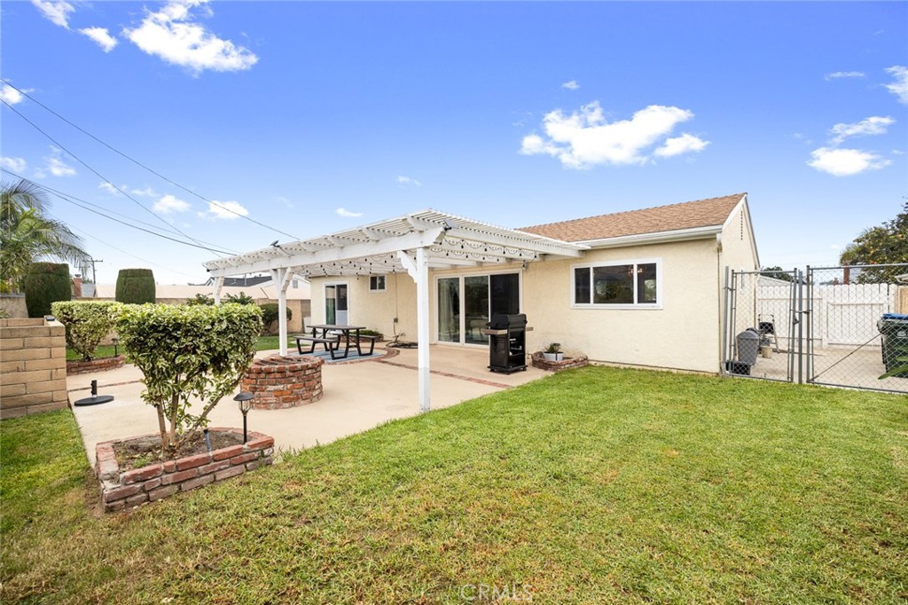 5472 Marion Avenue Cypress, CA 90630 - Photo 31 of 36 a view of a house with backyard and sitting area