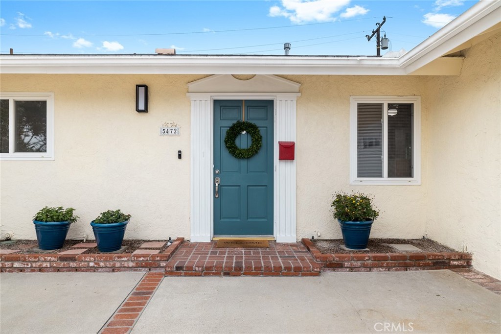 5472 Marion Avenue Cypress, CA 90630 - Photo 32 of 36 a potted plant sitting on the side of a building