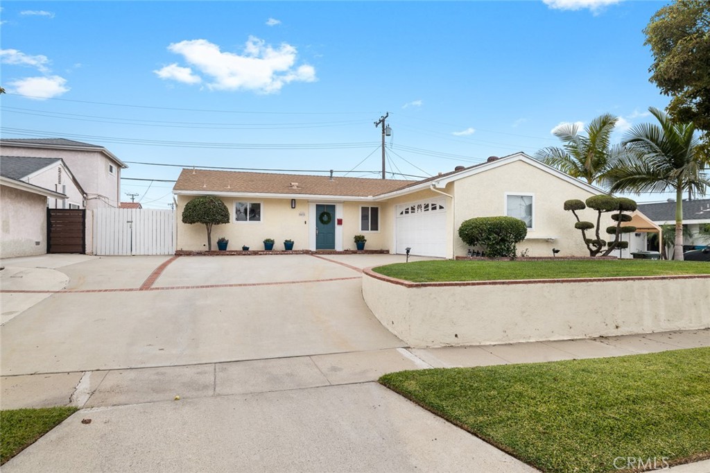 5472 Marion Avenue Cypress, CA 90630 - Photo 36 of 36 a front view of a house with garden