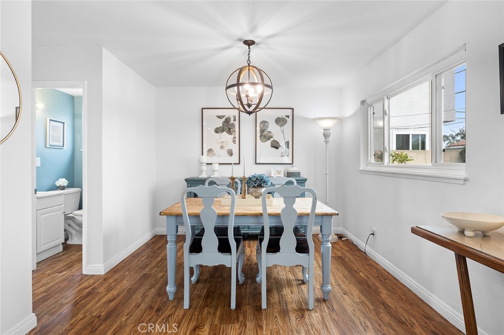5472 Marion Avenue Cypress, CA 90630 - Photo 5 of 36 a view of a dining room with furniture window and wooden floor