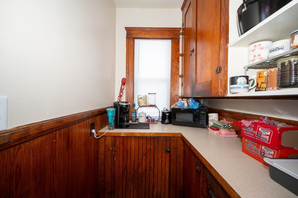 104 1/2 Rodney Street Worcester, MA 01605 - Photo 11 of 25 a kitchen with a sink and a stove