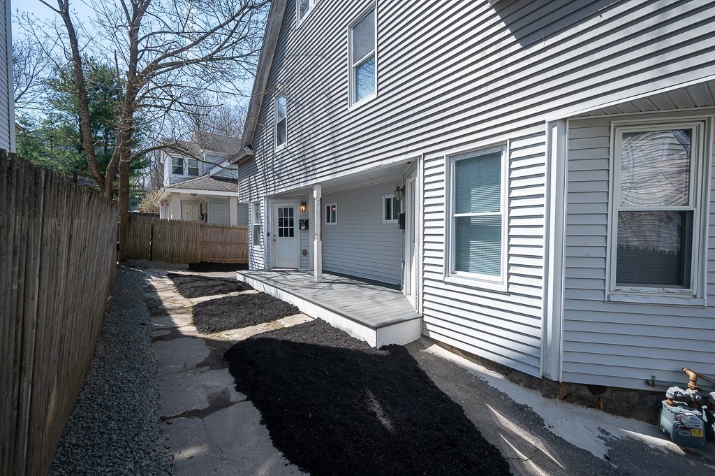 104 1/2 Rodney Street Worcester, MA 01605 - Photo 3 of 25 a front view of a house with windows
