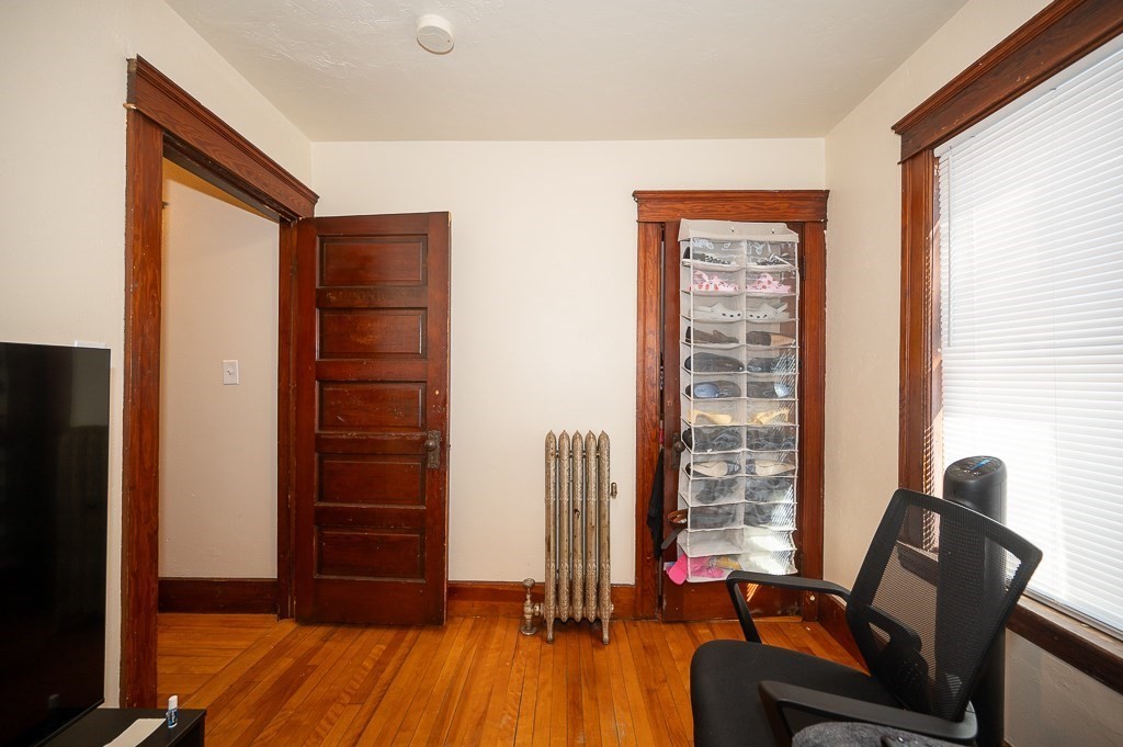 104 1/2 Rodney Street Worcester, MA 01605 - Photo 9 of 25 a view of workspace with wooden floor and windows