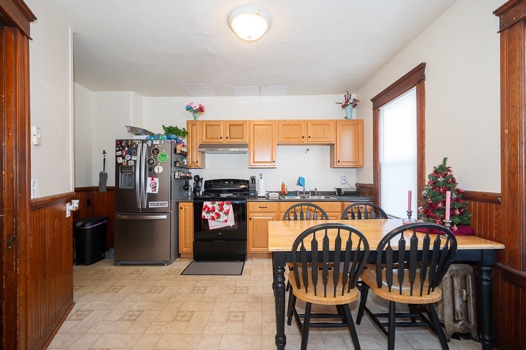 104 1/2 Rodney Street Worcester, MA 01605 - Photo 10 of 25 a view of a dining room with furniture window and outside view
